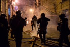 La Paz, Bolivia. 7th Nov 2019. The Police defended together with government supporters the access to the main square of La Paz, Plaza Murillo. Opposition supporters used fireworks and dynamite, but had to withdraw after the heavy use of tear gas by the Bolivian riot Police (UTOP). Fires were lit by the protesters to reduce the effects of the tear gas. Radoslaw Czajkowski